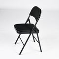 Set of Four Black Faux Leather and Steel Folding Chairs